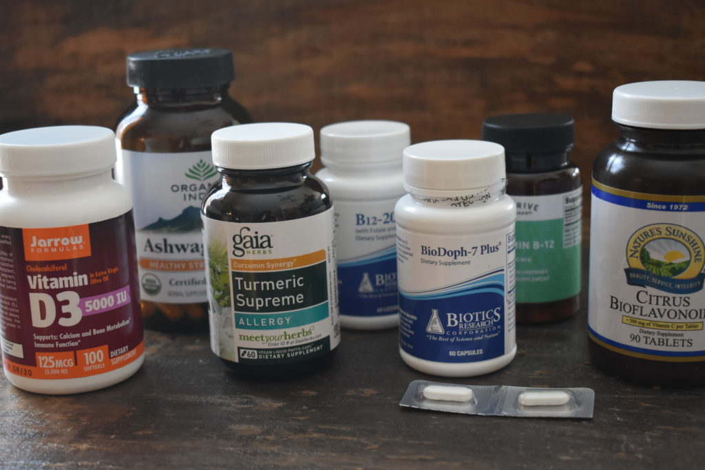 Are Dietary Supplements Necessary. A variety of supplements on a table.