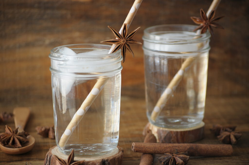 Drinks to Improve Your Health with two glasses of water and paper straws.