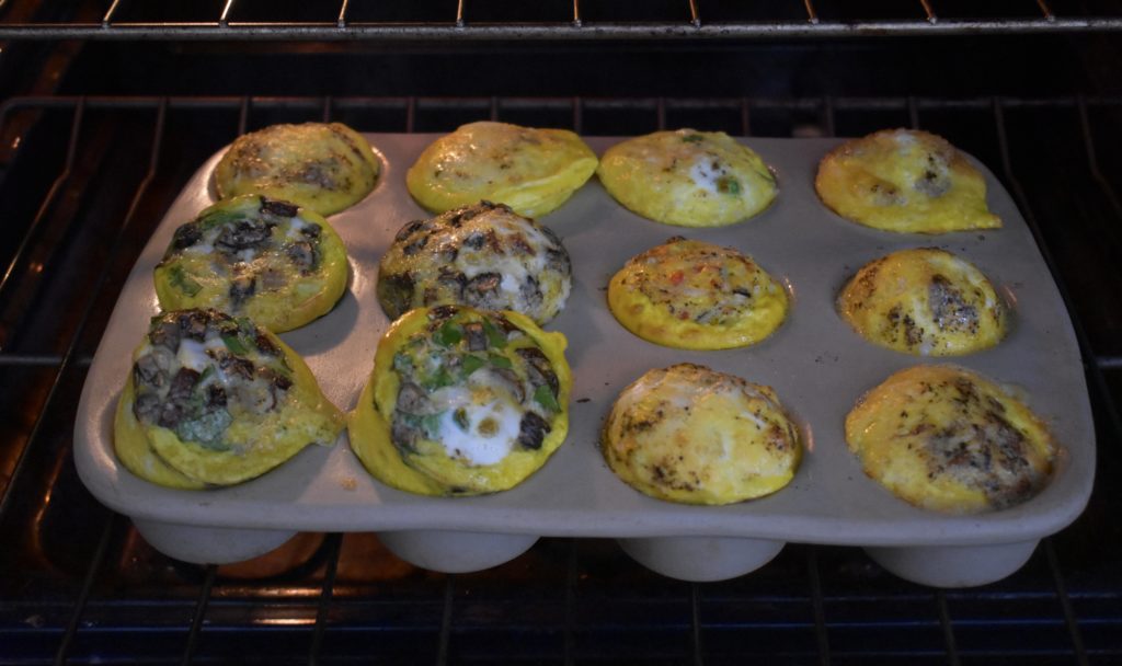 Omelet Breakfast Muffins. Omelet Muffins coming out of the oven.