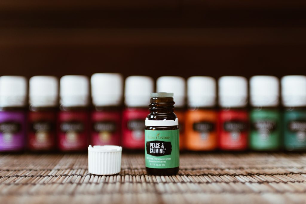 How to use Powerful Essential Oils for Everyday Use. Several essential oil bottle lined up.