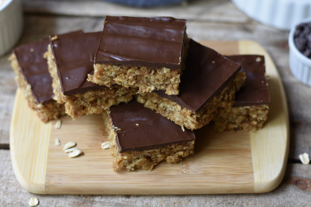 Gluten free peanut butter chewy bars stacked.
