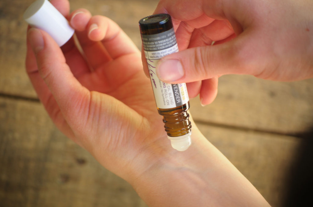Essential Oil Use for Teens.  A person applying oil to their wrist.