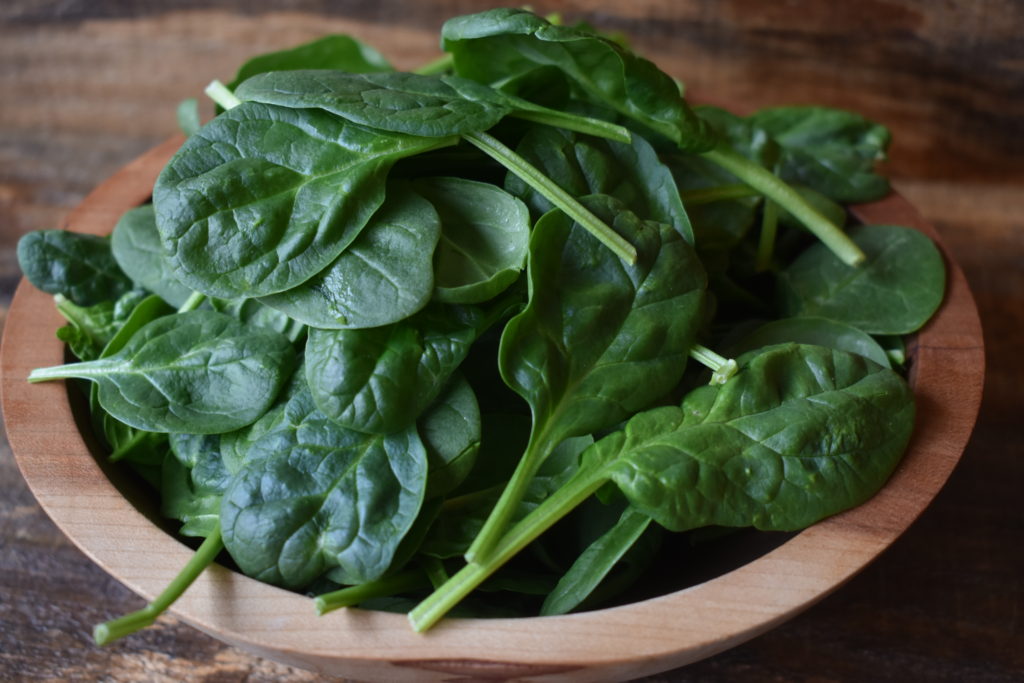 Natural sources of iron for anemia.  A large bowl of spinach.