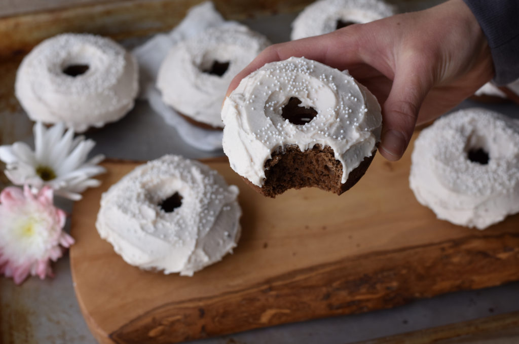 Grain Free Brownie Doughnuts Everyone Will Love with someone holding it.