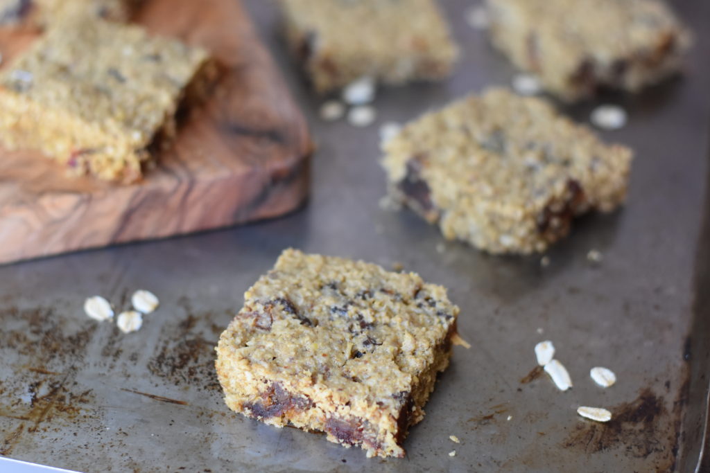 Oatmeal Coconut Date Bars on a cookie tray.