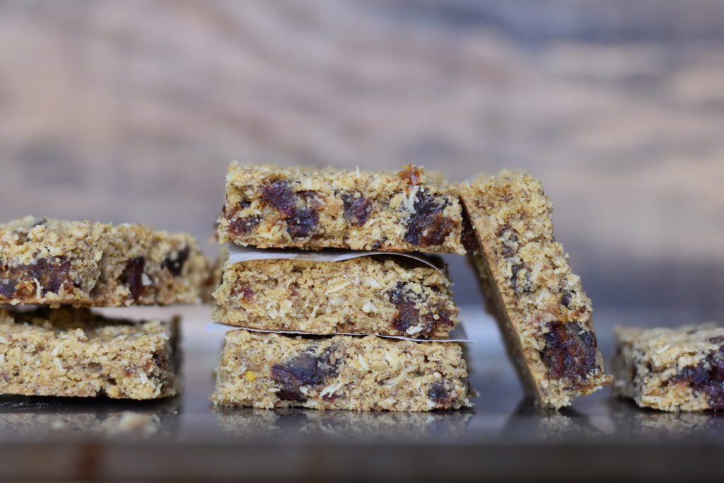 Oatmeal Coconut Date Bars displayed on a tray.