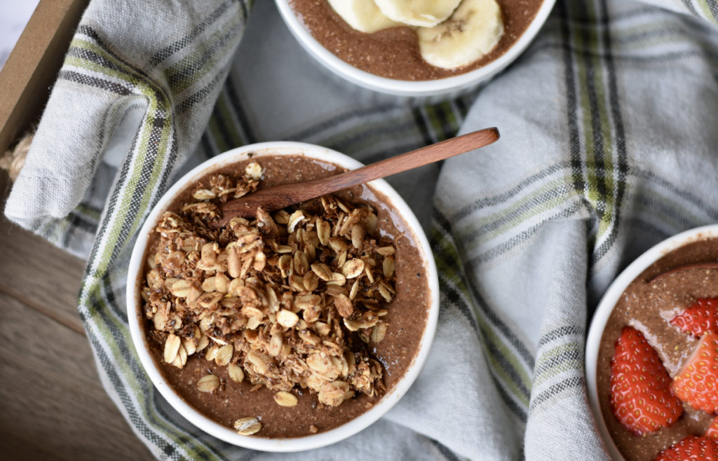 Nutritious Breakfast Ideas for Busy People.  A bowl of chocolate chia pudding topped with granola.