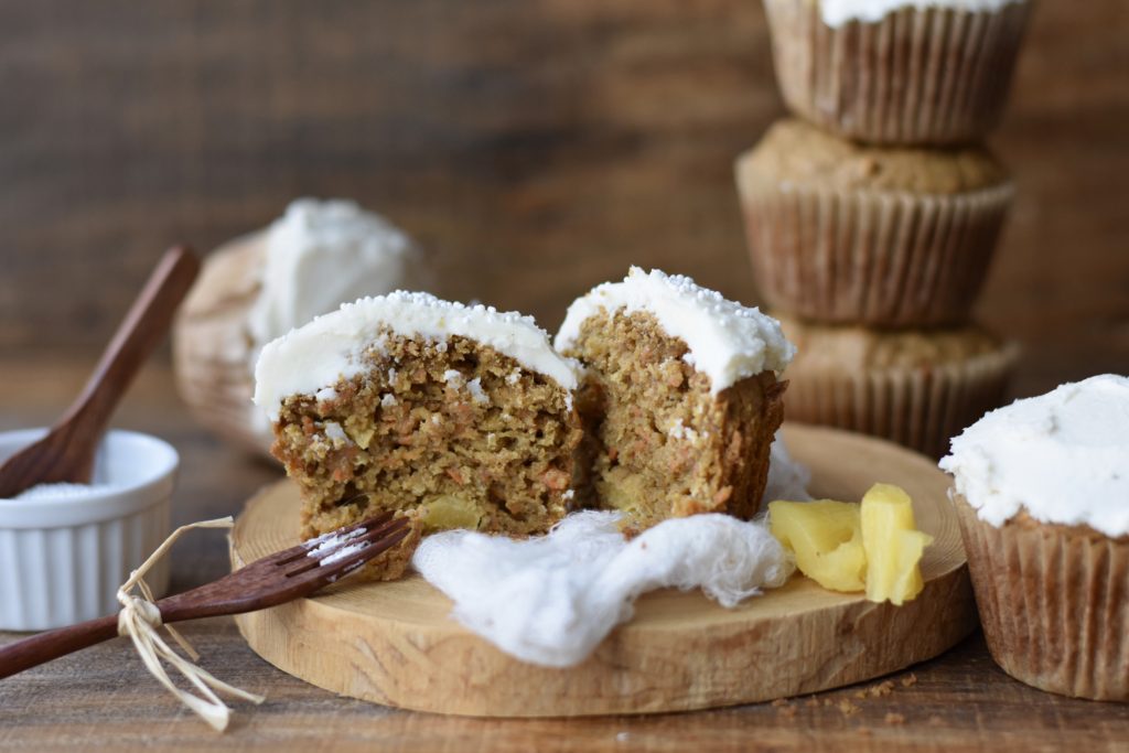 Gluten Free Carrot Cake Breakfast Muffins with one cut in half.