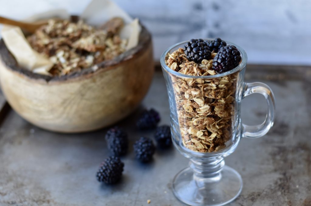Amazing gluten free granola served in a clear glass.
