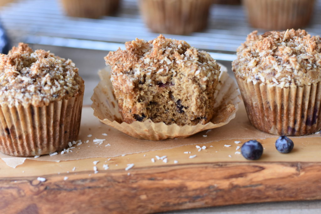 A bite out of a grain free blueberry collagen muffin.