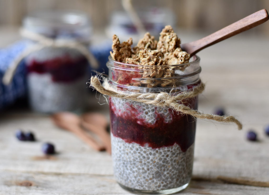 Blueberry Vanilla Chia Pudding with granola on top.