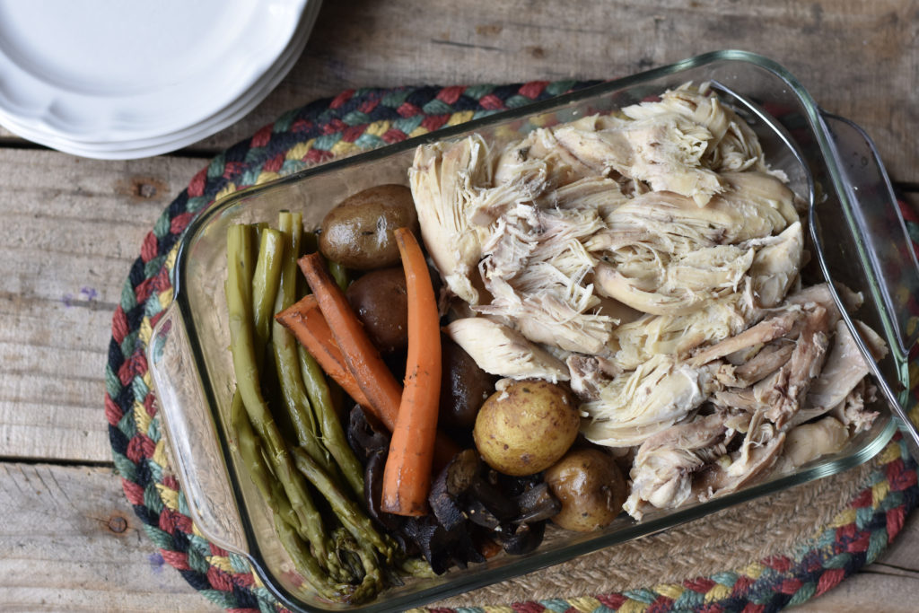 Crock Pot Roasted Chicken and Vegetables in a serving dish.