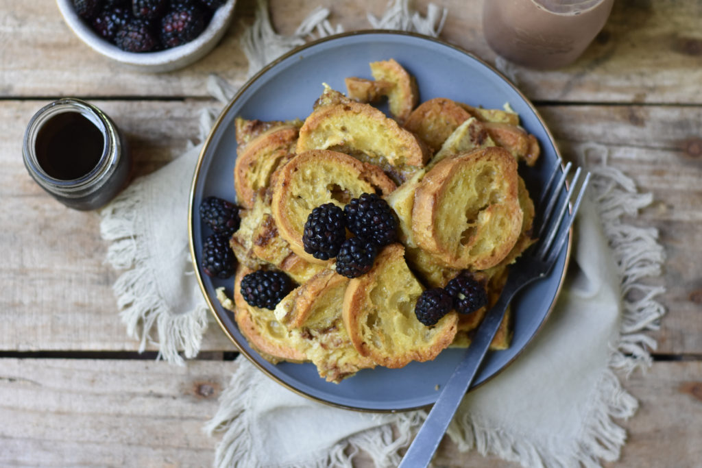 Nutritious Breakfast Ideas for Busy People.  A grey plate with baked French toast on it topped with blackberries.