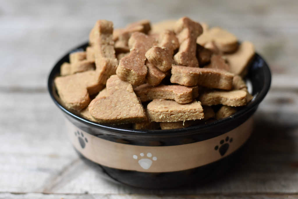 How to Make Healthy Dog Treats at Home with a bowl full of dog treats.