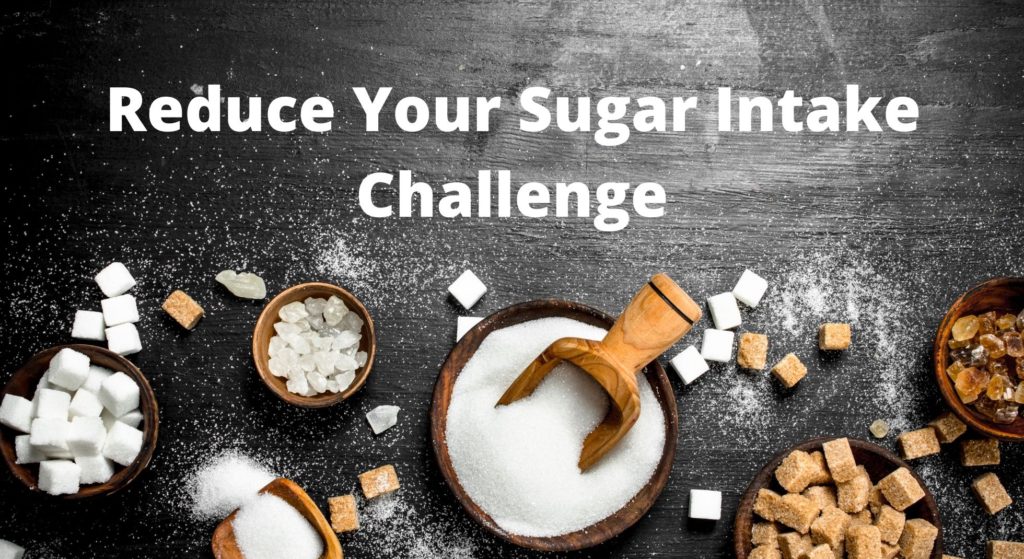 
A variety of white, brown and cubed sugar in a wooden bowl symbolize the low sugar consumption challenge.