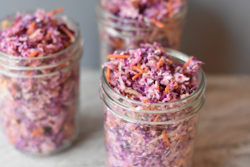 How to prepare for travel with food allergies - make food ahead of time like the three jars of Cole slaw.