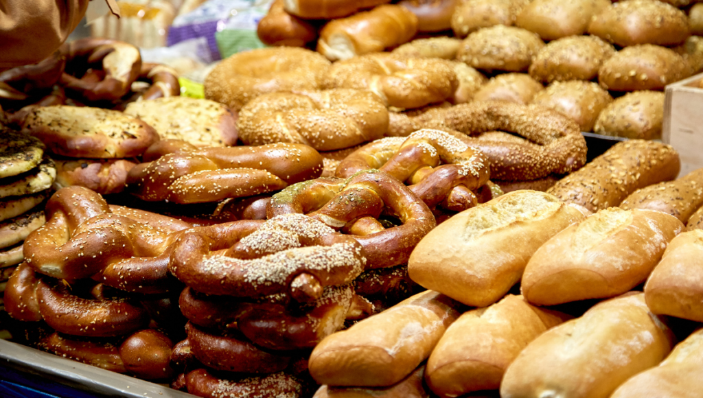 What is inflammatory food and chronic inflammation?  A picture of wheat based products such as pretzel, doughnuts and rolls.