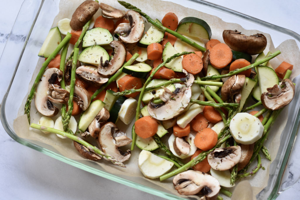 Freshly prepared vegetables for roasted vegetables and mushrooms side dish.