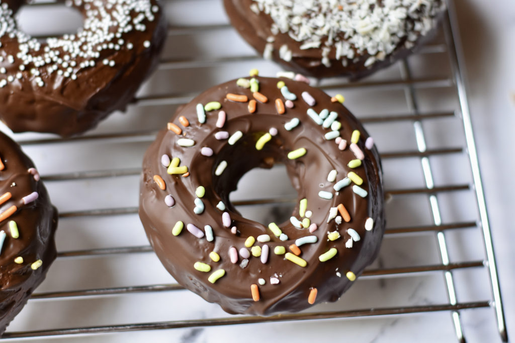 Grain free cake doughnuts with natural sprinkles on top.