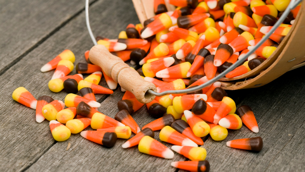 Avoid this popular food for better health. A picture of a bucket of candy corn.
